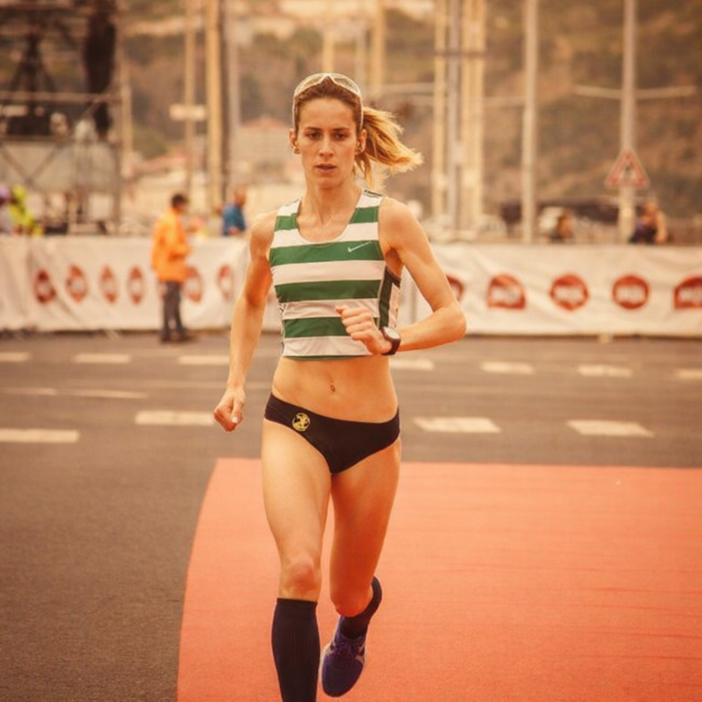 A runner in dark athletic pants