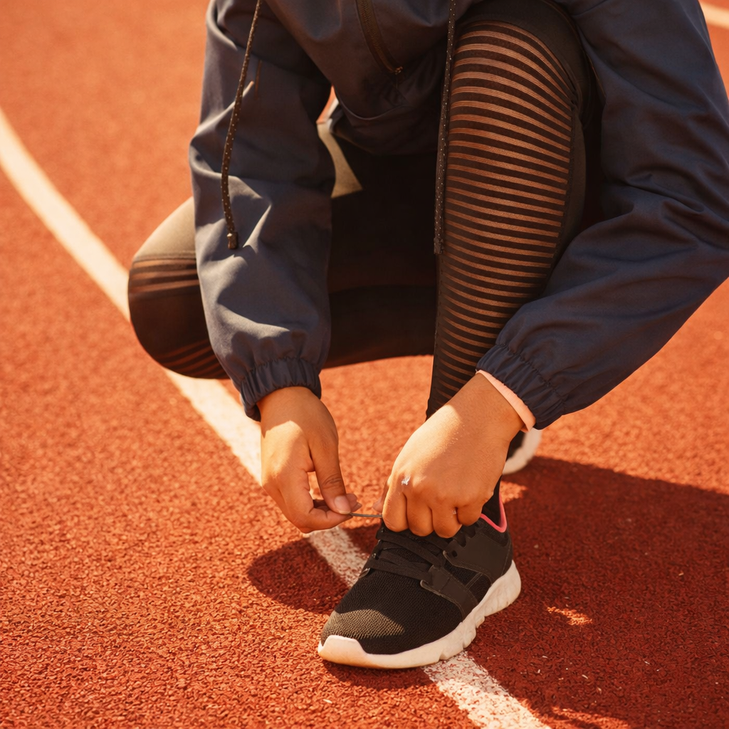 A runner in dark athletic wear